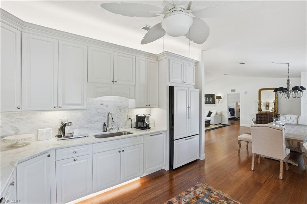 Newly reimagined kitchen with custom cabinetry, marble and stone finishes with high-end appliances