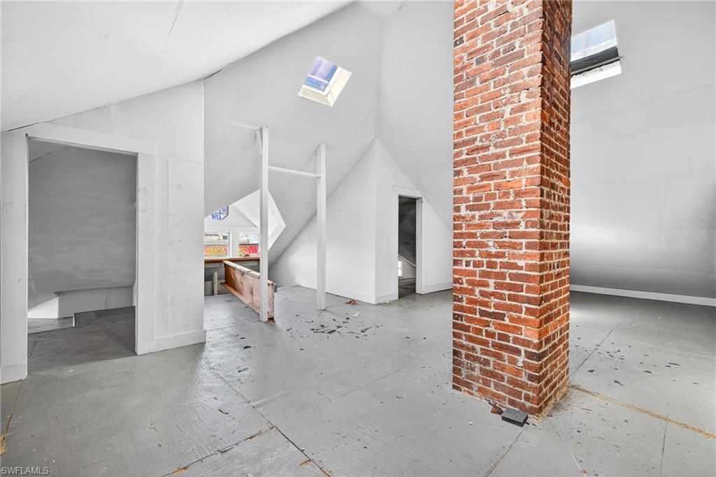 Bonus room with a skylight and lofted ceiling