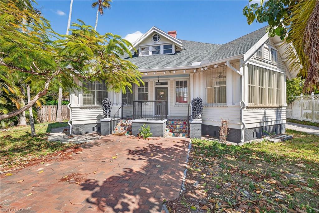 Bungalow-style house with a porch, crawl space, a chimney, and roof with shingles