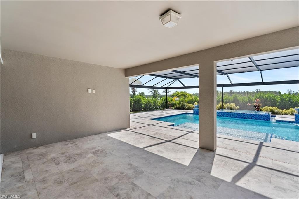 Outdoor pool featuring a lanai