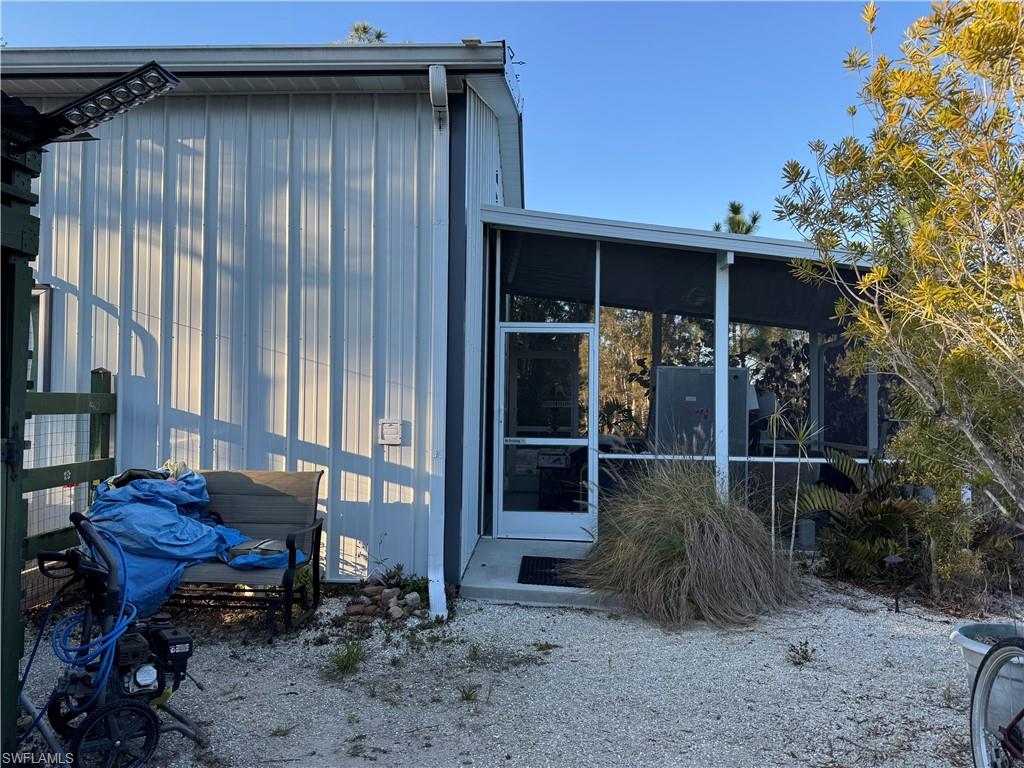 View of home's exterior featuring a sunroom