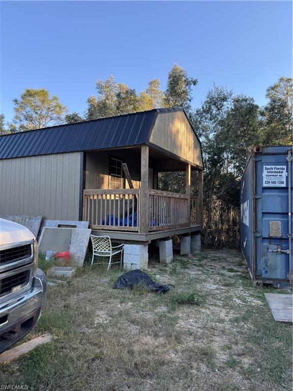 Front porch of Bldg 2. As per seller 40x14. Unfinished out building being used as storage.