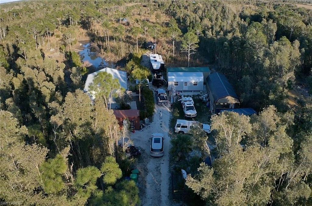 Drone / aerial view of a partially wooded area