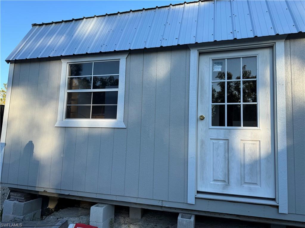 Bldg 3 View of outdoor structure. Unfinished and used presently as storage.