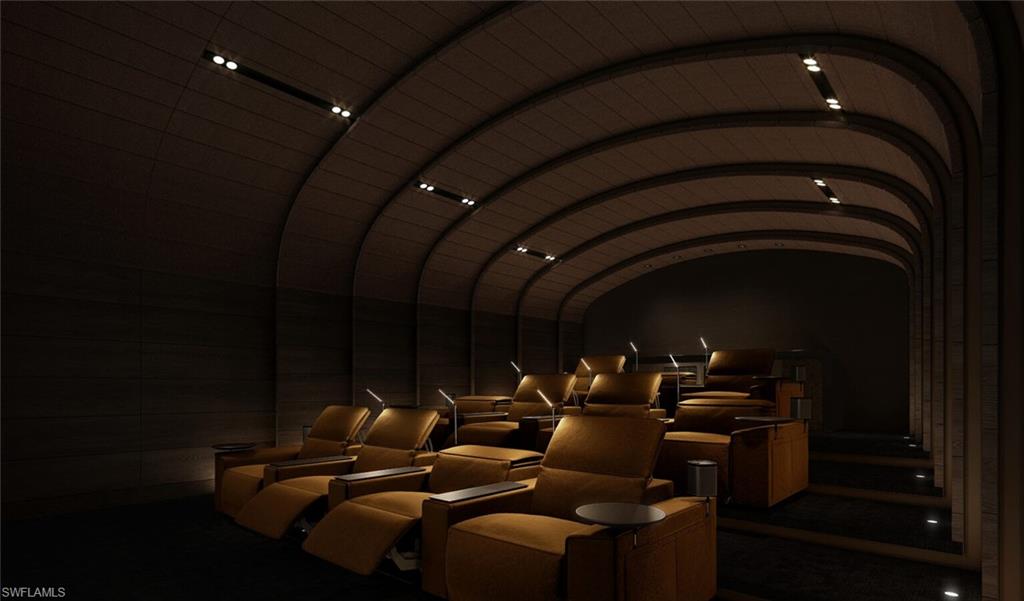 Theater featuring lofted ceilings