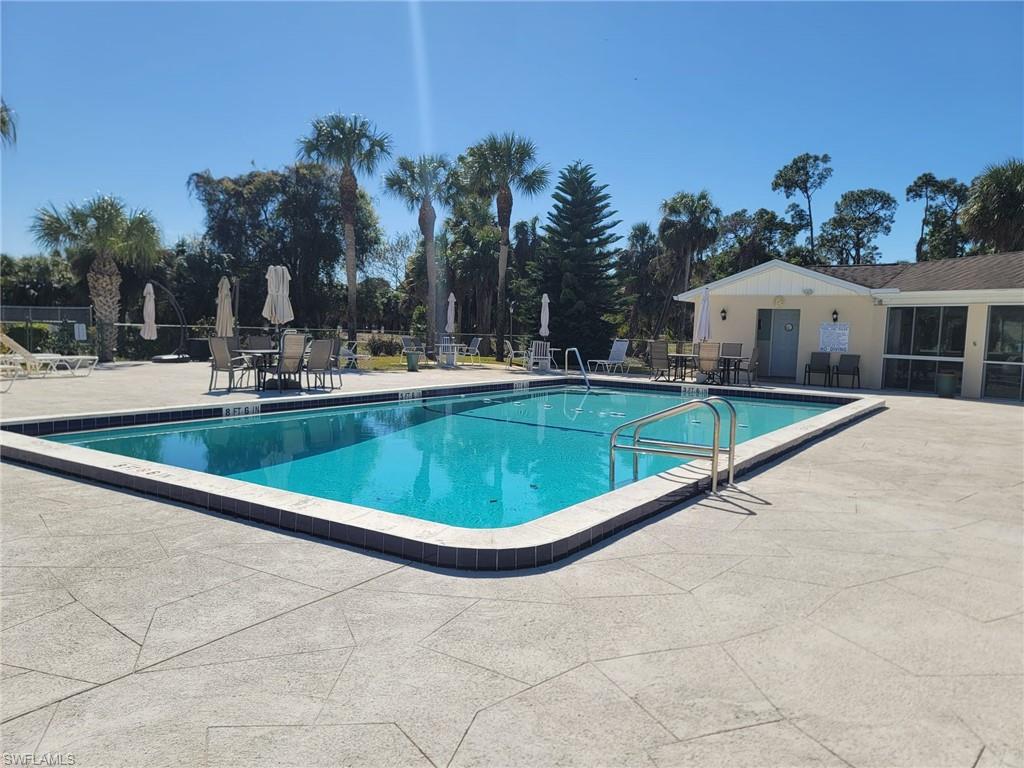 Community pool featuring a patio