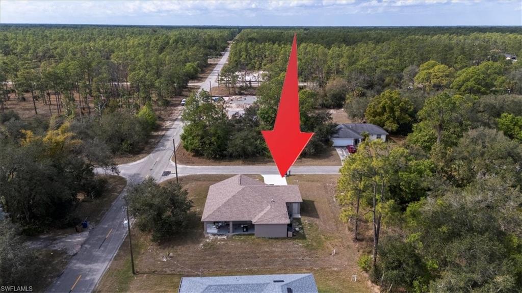 View of property location with a forest