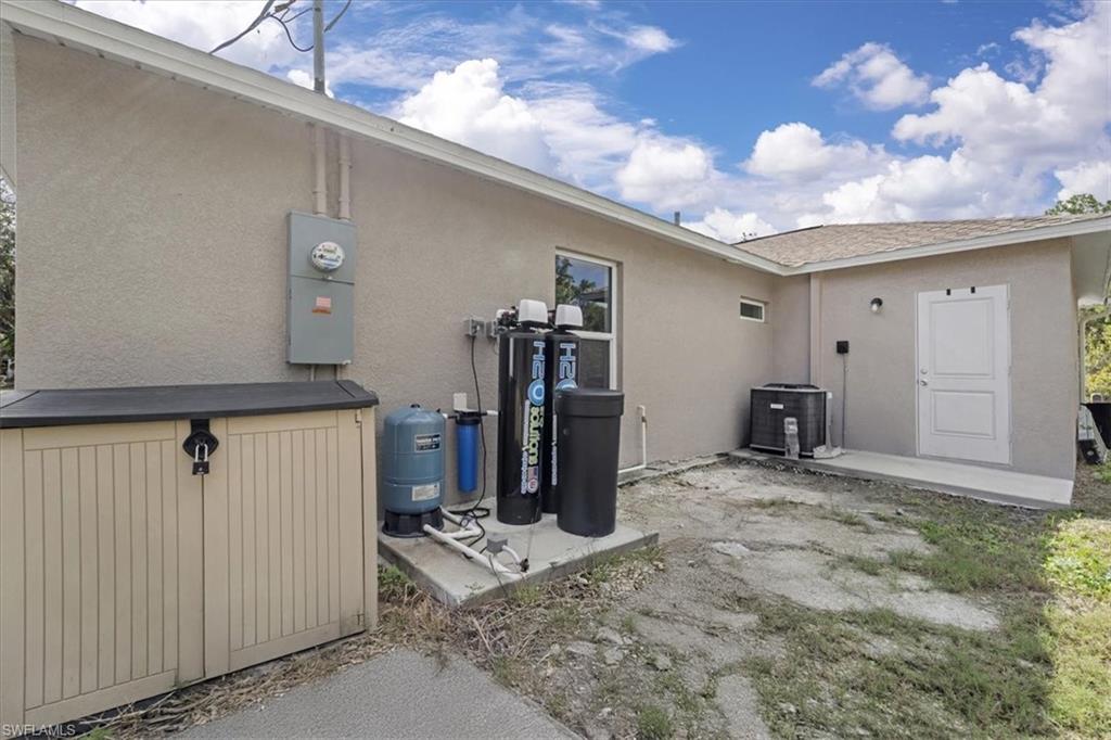 Rear view of property with stucco siding