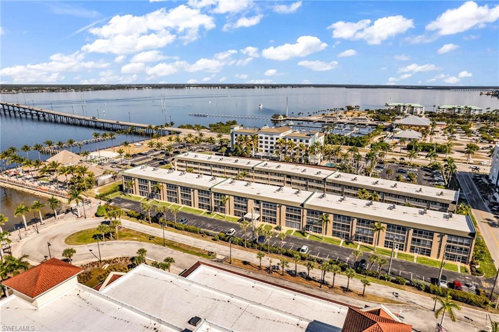 Drone / aerial view of a nearby body of water and a notable bridge