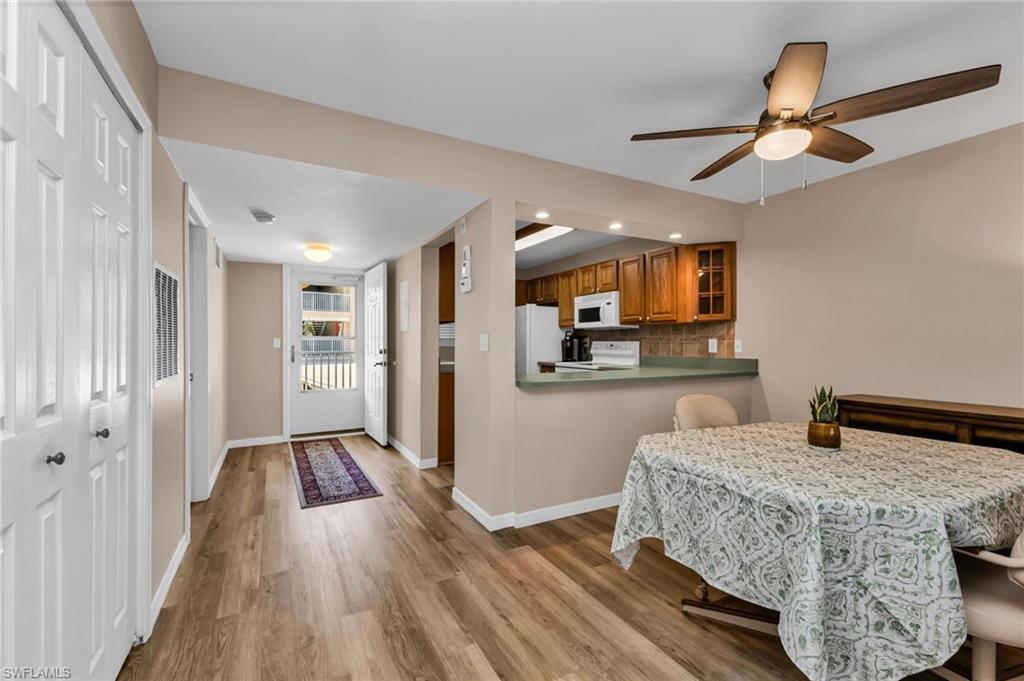 Dining space featuring light wood-style flooring and ceiling fan