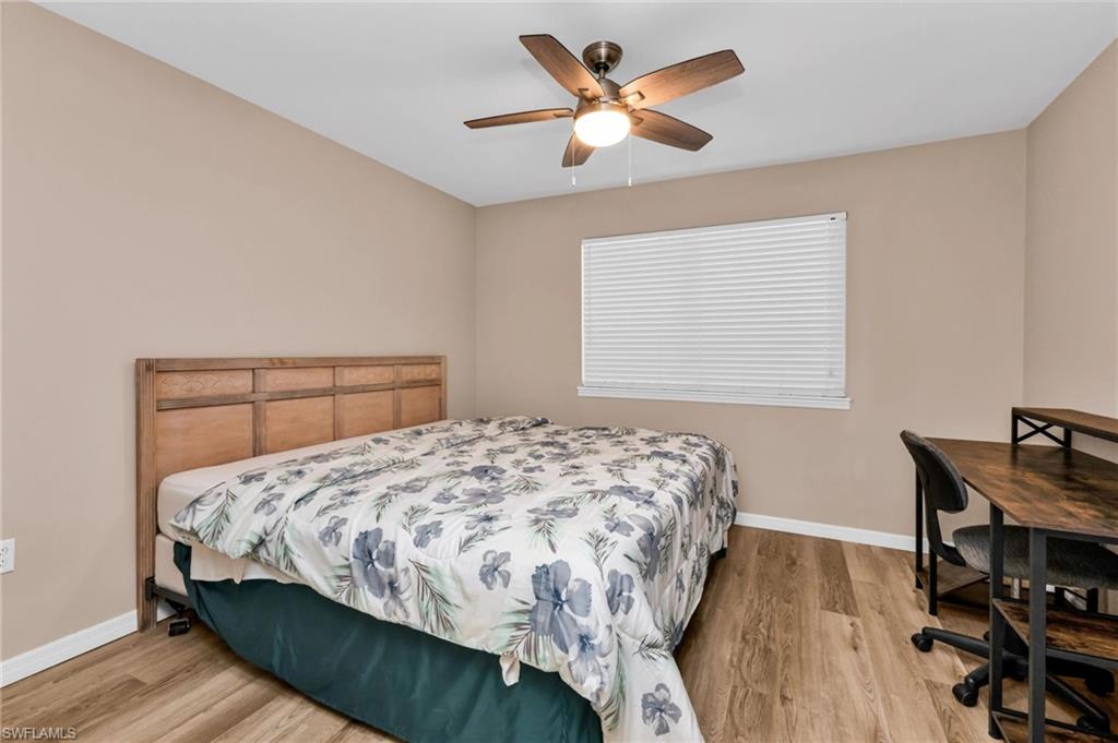 Bedroom featuring light wood finished floors and a ceiling fan
