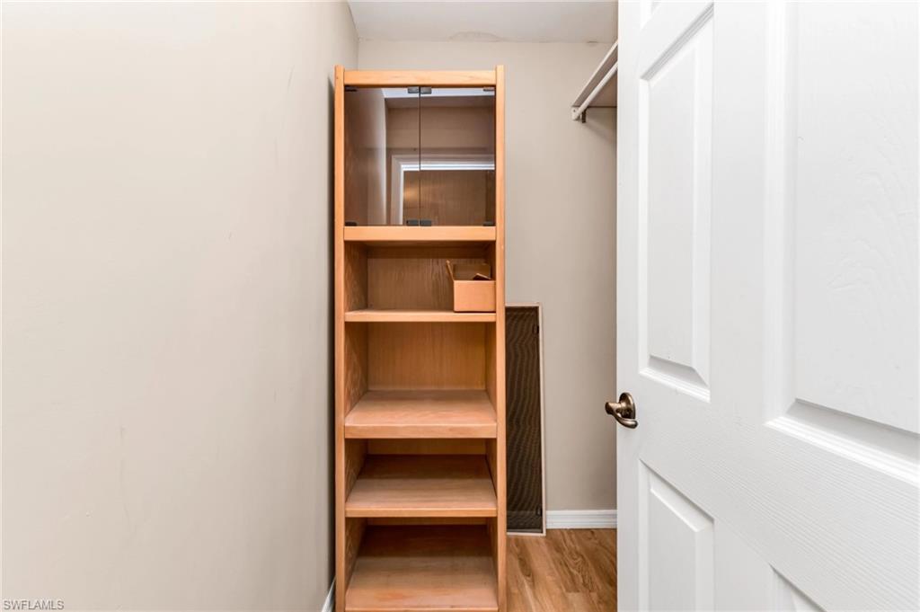 Walk in closet featuring light wood-style floors