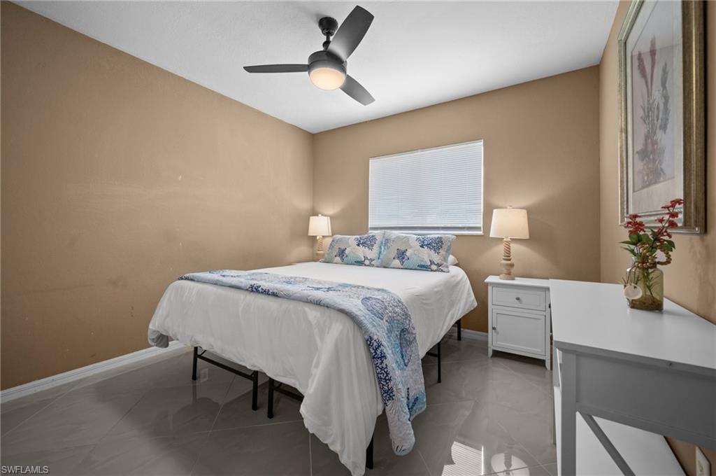 Bedroom with baseboards and a ceiling fan