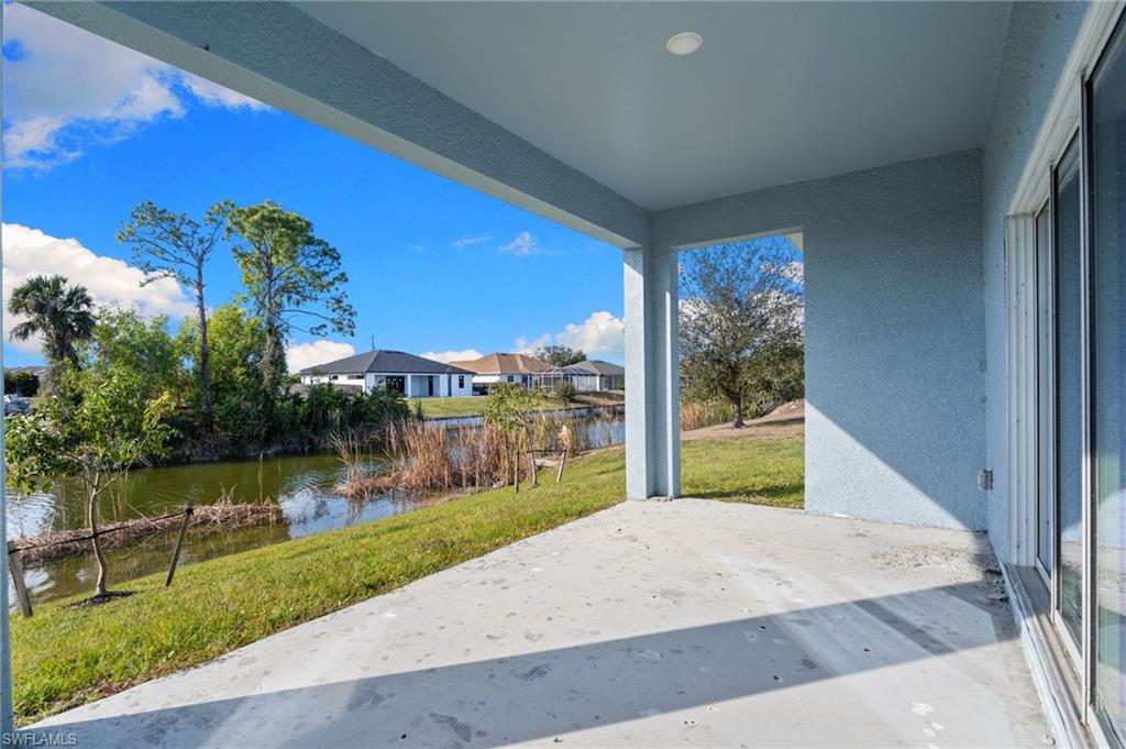 View of patio with a water view and a residential view