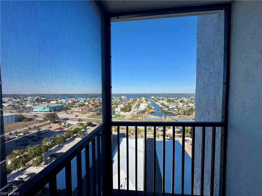 Balcony with a view over the carports out to the canal front dock and view down to the Bay from the Master bedroom balcony
