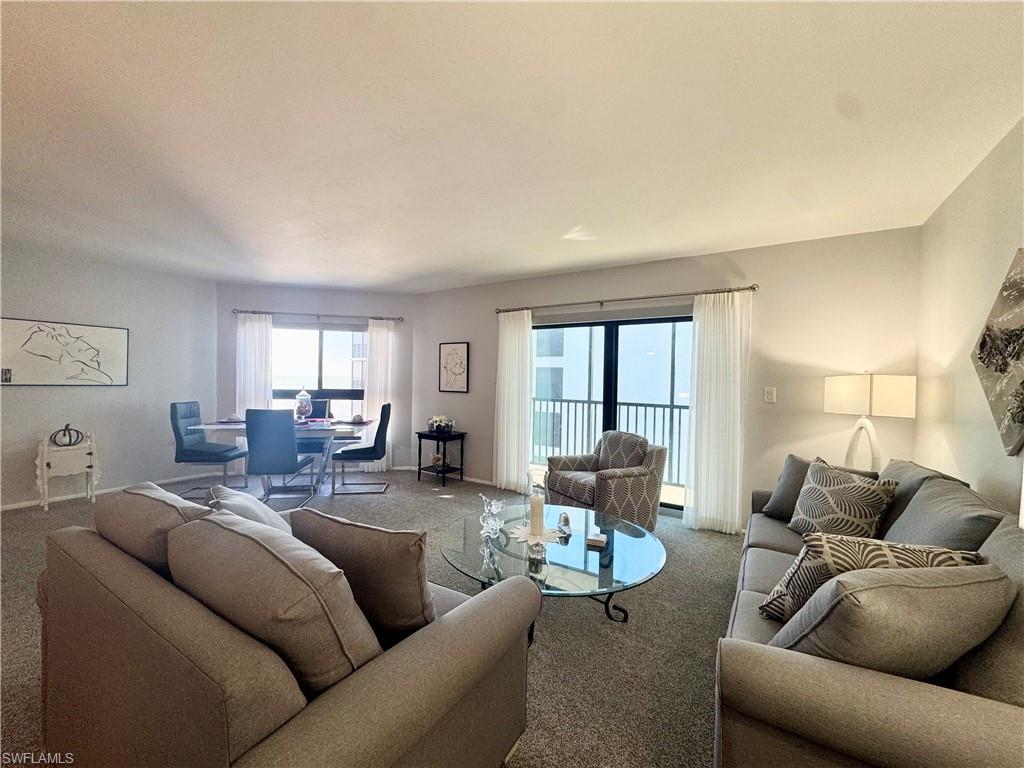 Carpeted living room with views out to the Gulf of Mexico