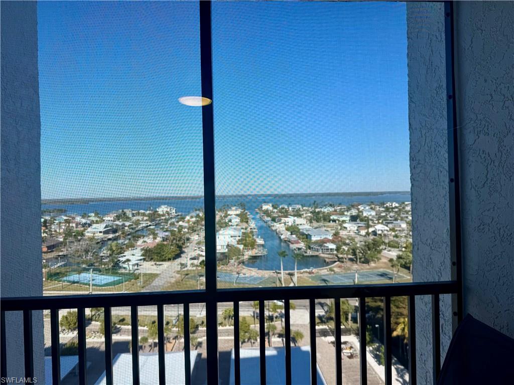 Tennis courts, canal front dock and view down the canal from the guest bedroom window