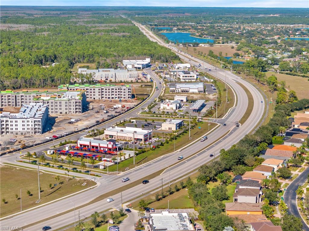 Aerial view of property's location with a nearby body of water