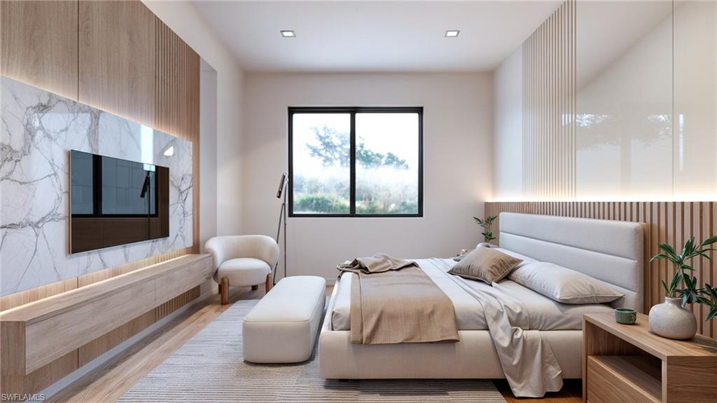 Bedroom with wood finished floors and an accent wall (Rendered photo)