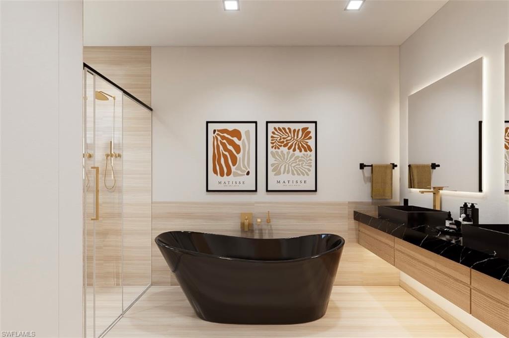 Full bathroom with a stall shower, a freestanding bath, vanity, and tile walls (Rendered photo)