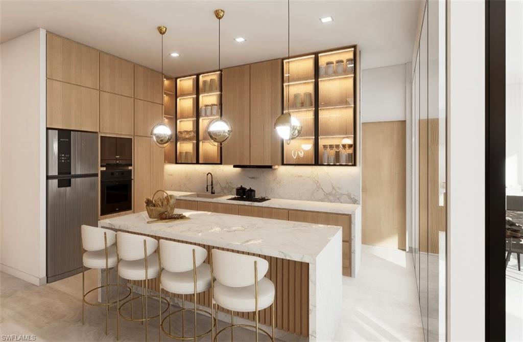 Kitchen featuring hanging light fixtures, light wood finish cabinetry, modern cabinets, and light stone countertops (Rendered photo)