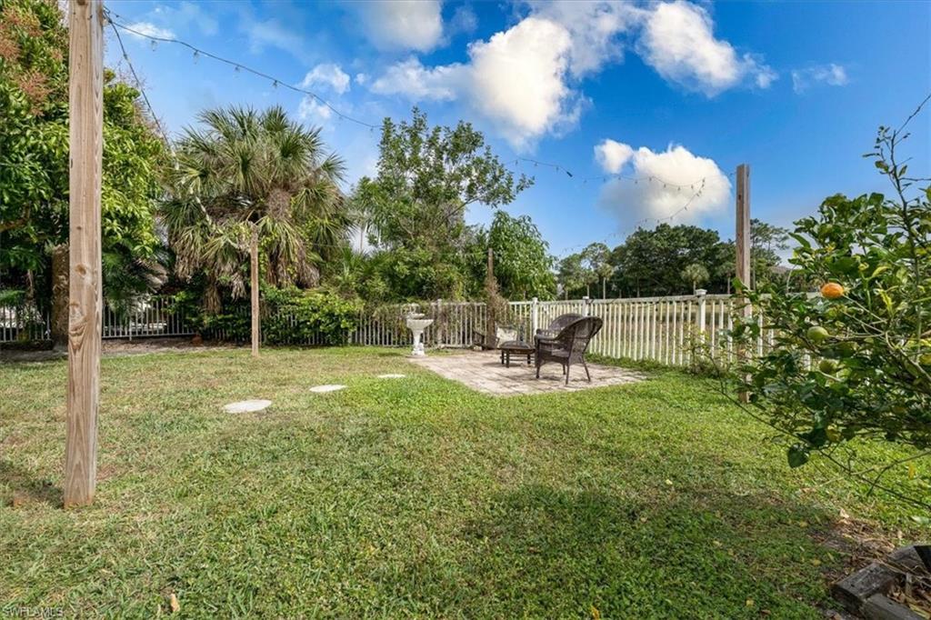 Fenced in Backyard with with of Lake