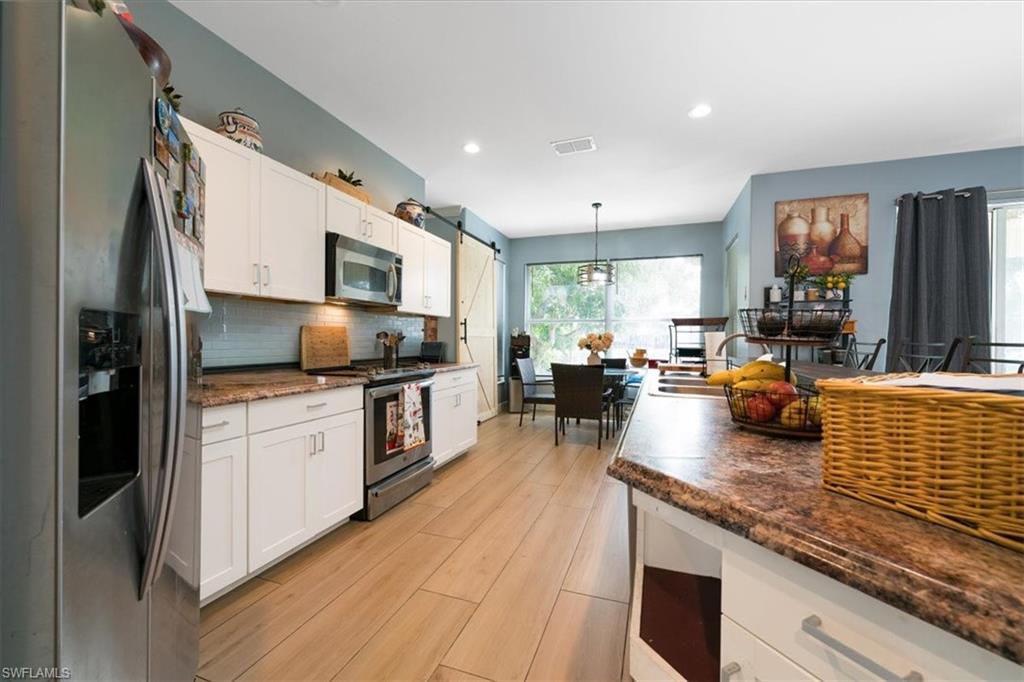 Large Kitchen with white shaker cabinetry