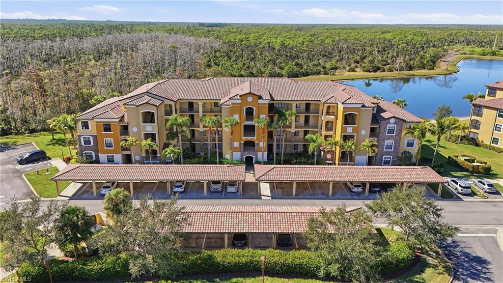 Aerial view of apartment complex / building and a large body of water