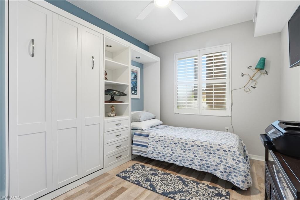 Bedroom featuring light wood-type flooring and ceiling fan