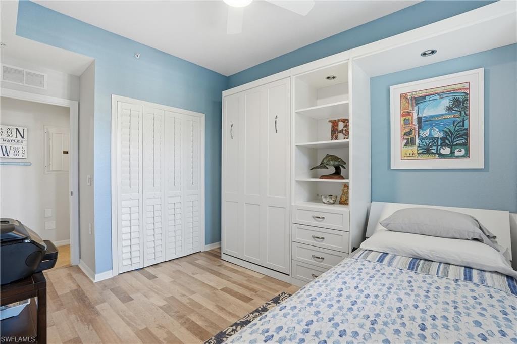 Bedroom with a closet and light wood-style floors