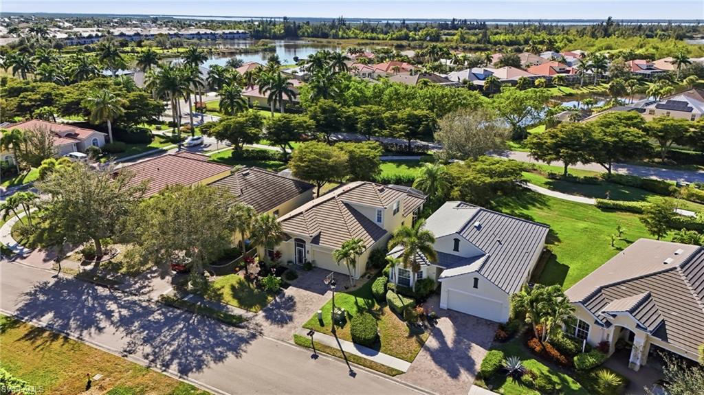 Aerial perspective of suburban area featuring a large body of water