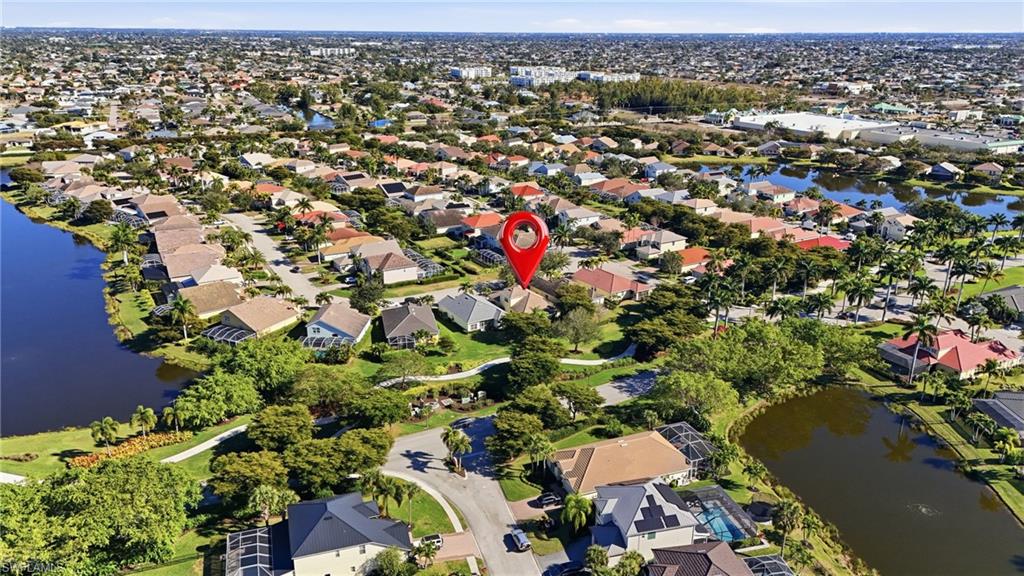 View of property location featuring a nearby body of water and nearby suburban area