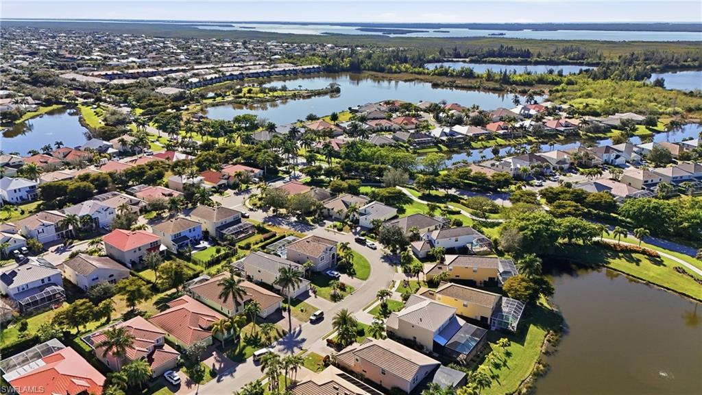 View of property location featuring a large body of water and nearby suburban area
