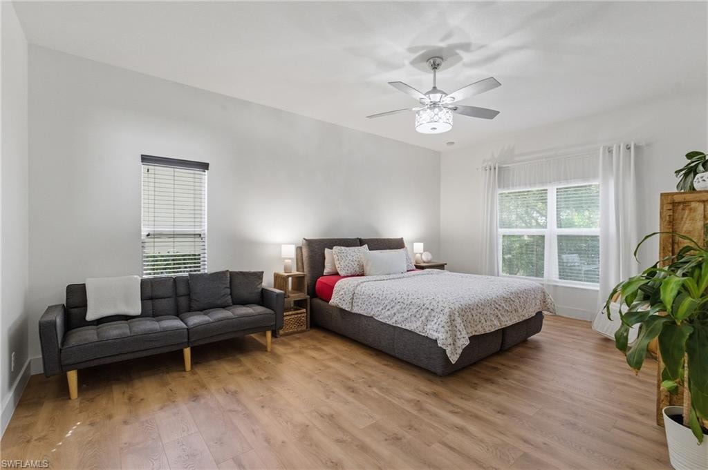 Bedroom featuring wood finished floors and a ceiling fan