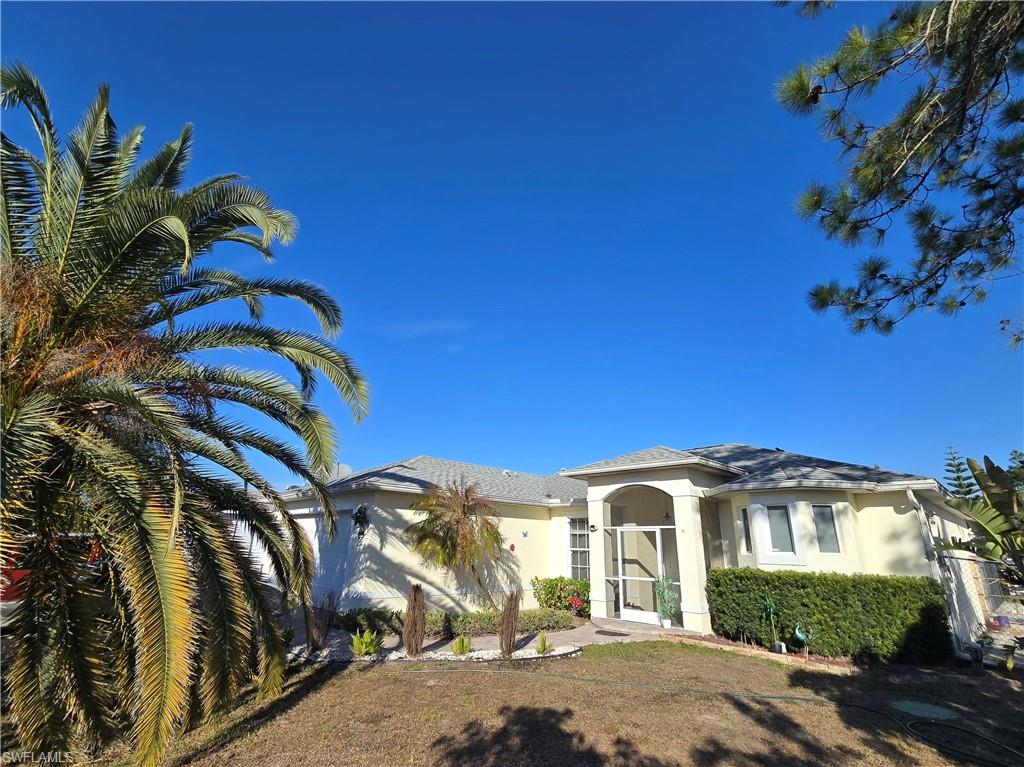 View of front of home featuring stucco siding