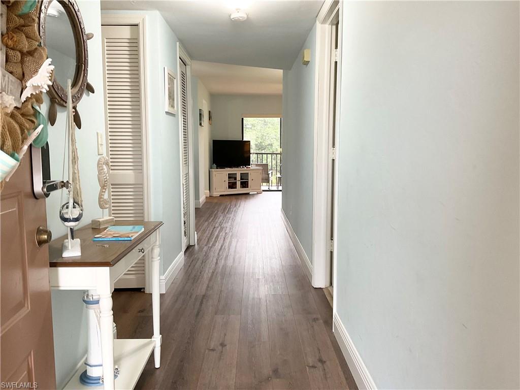 Hallway featuring dark hardwood / wood-style floors