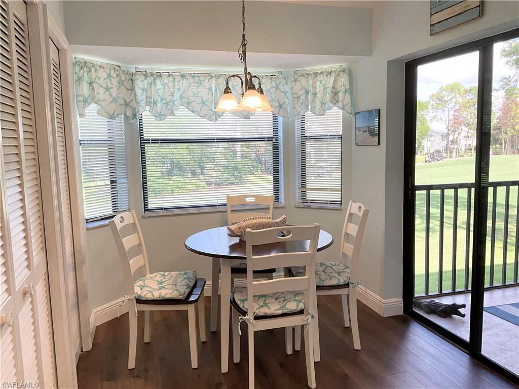 Kitchen has eat-in area with sliders to the lanai