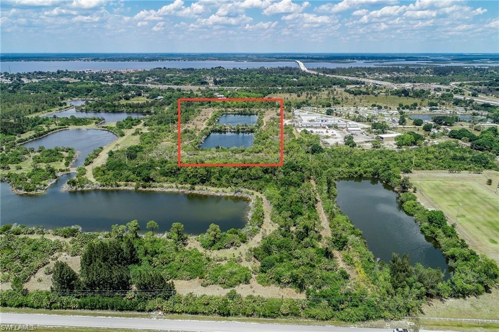 View of property location featuring property boundaries highlighted and a nearby body of water
