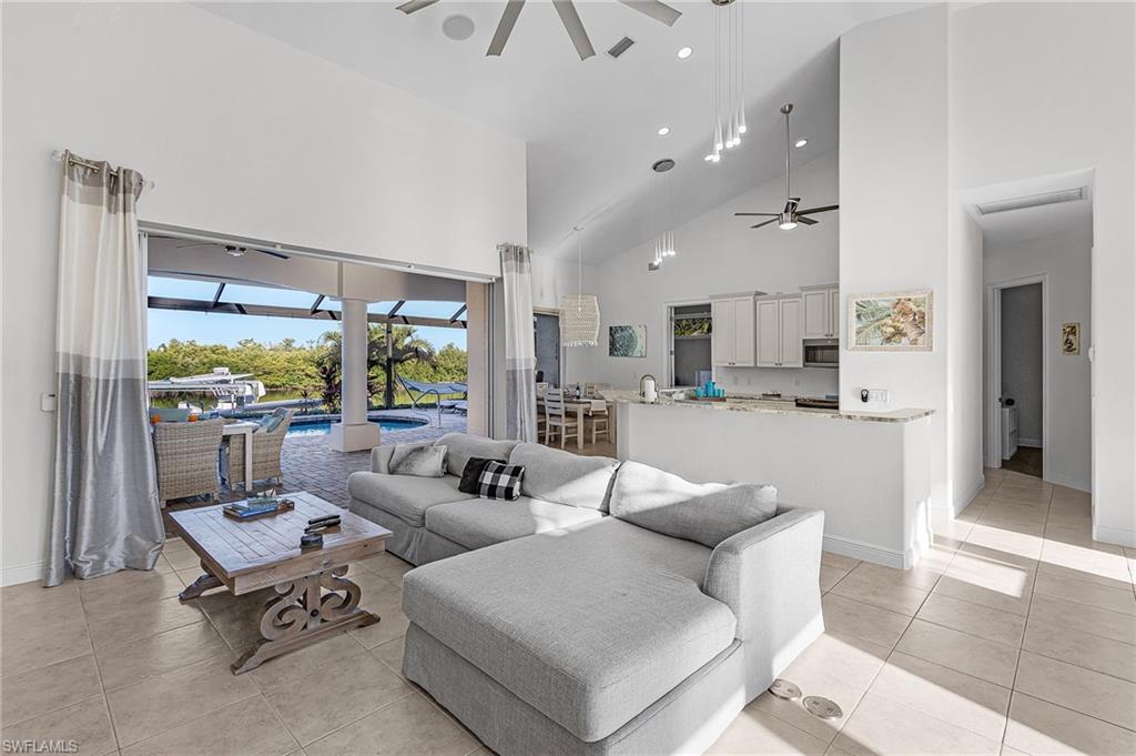 Living Room w/ ample seating and pool view