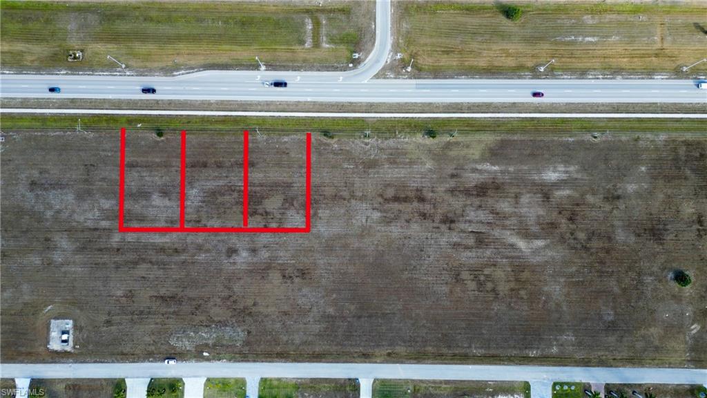 Aerial view of property's location featuring property parcel outlined