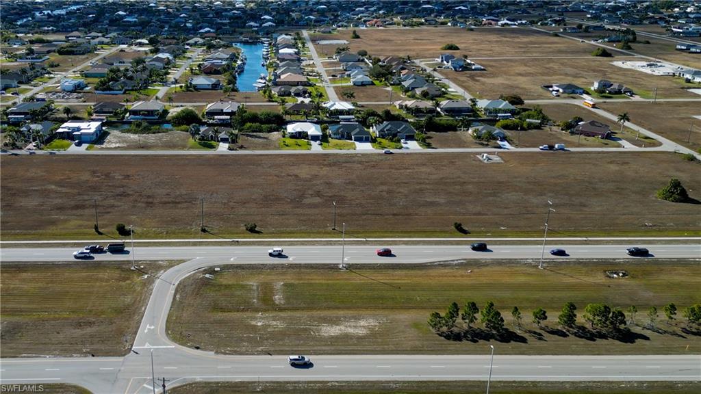 Aerial overview of property's location with nearby suburban area