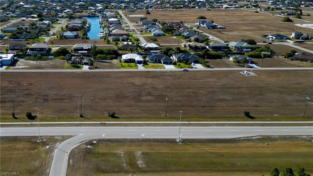 Aerial overview of property's location featuring nearby suburban area