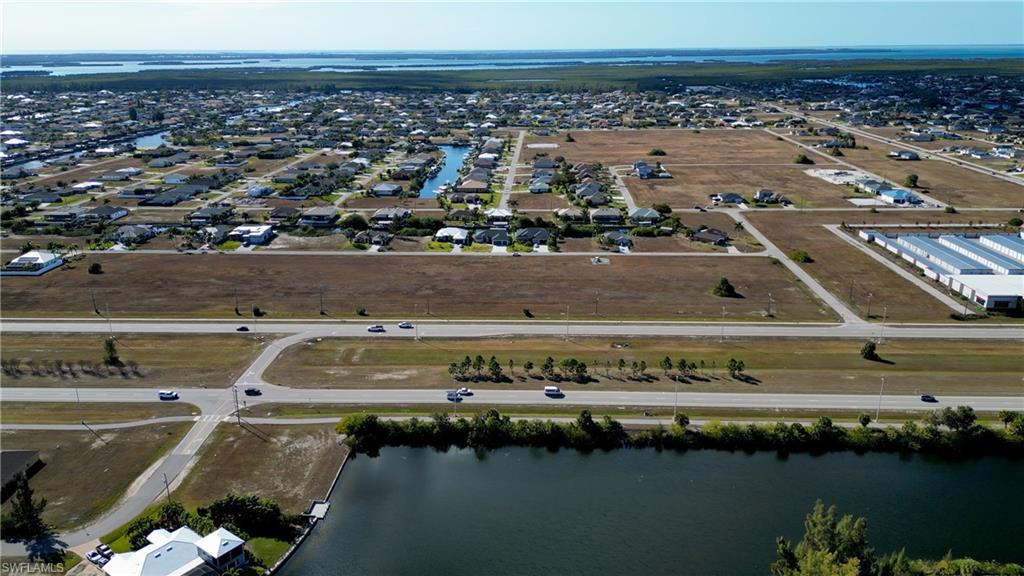 View of property location featuring nearby suburban area and a large body of water