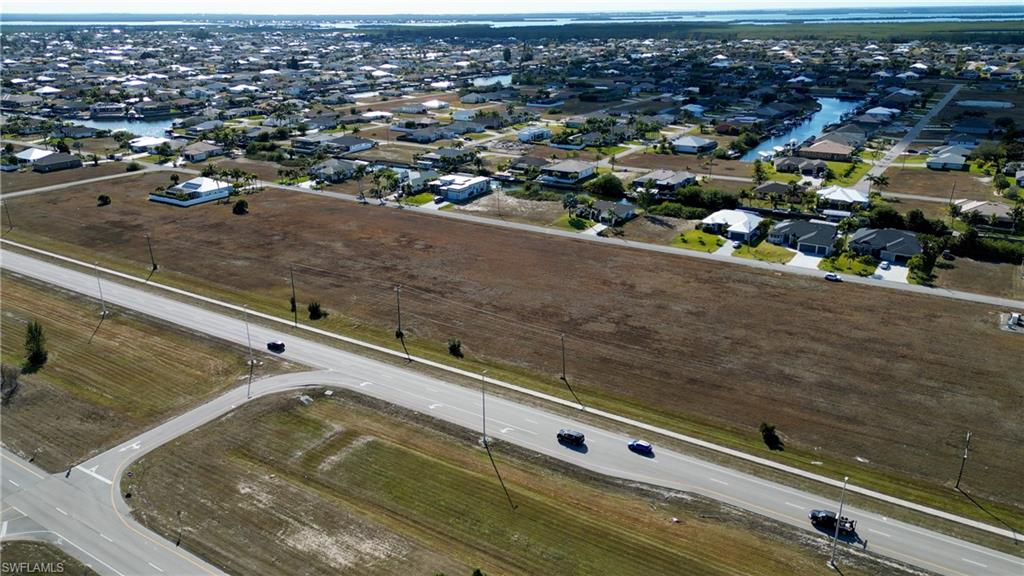 Aerial overview of property's location featuring nearby suburban area