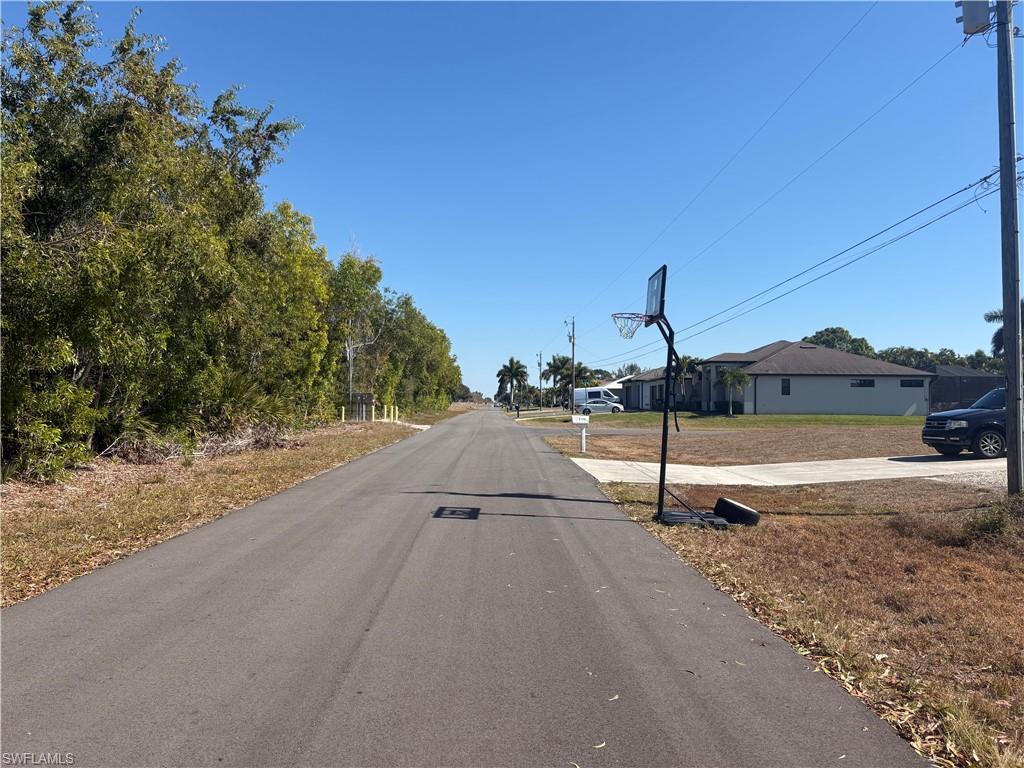 View of asphalt street with a residential view