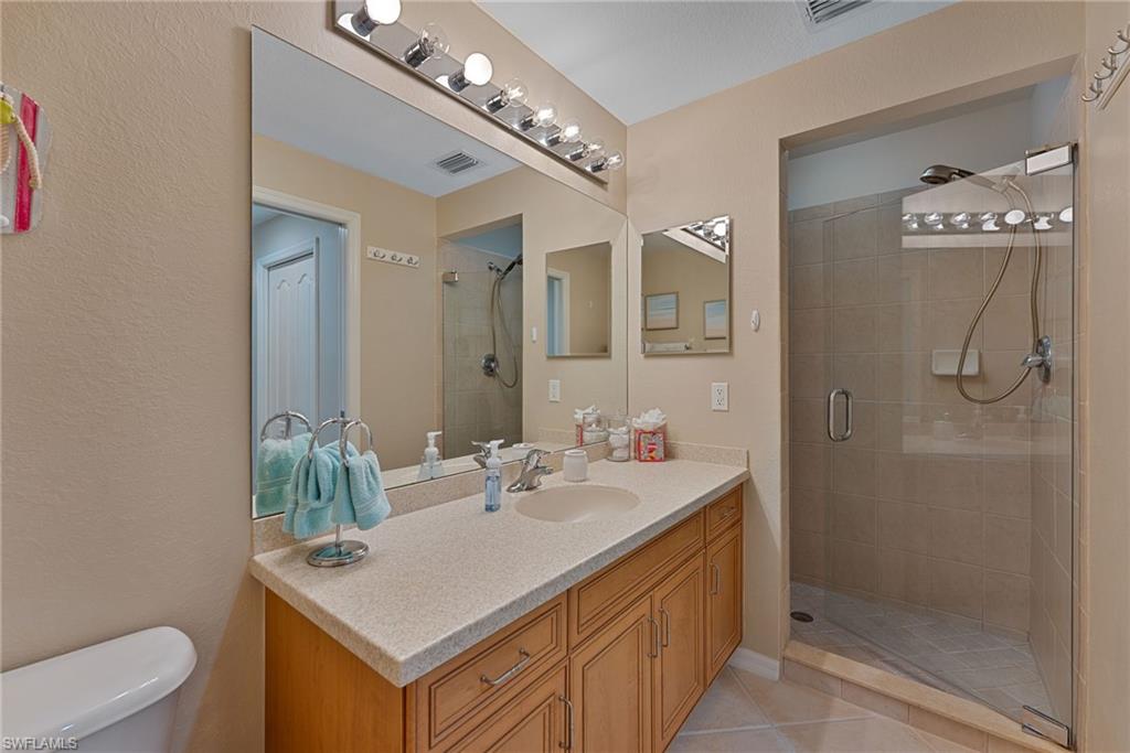 Primary Bath with walk in shower and extra long vanity