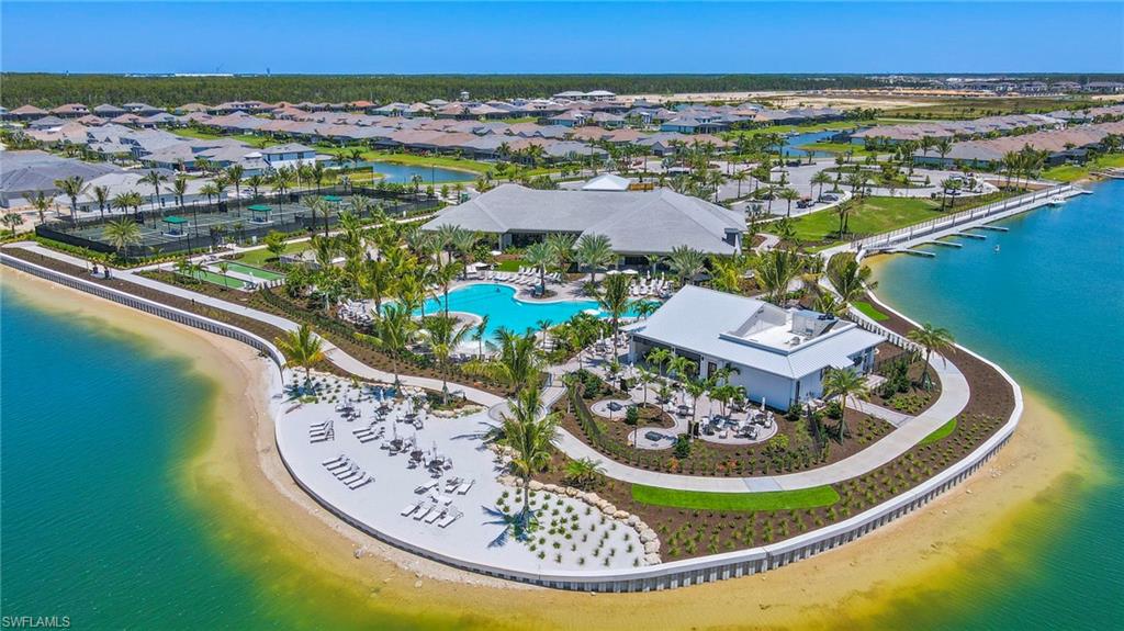 Drone / aerial view of a pool and a large body of water