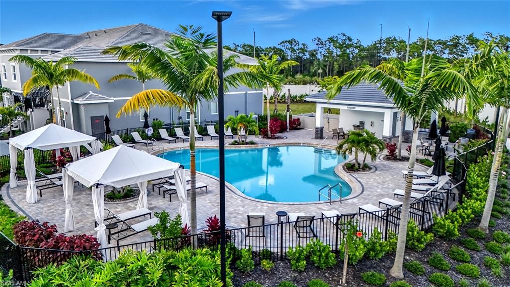 Community pool featuring a patio and a gazebo