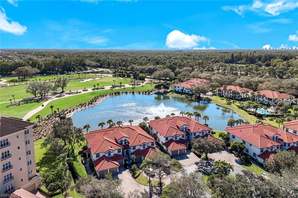 Drone / aerial view of a large body of water and a golf course
