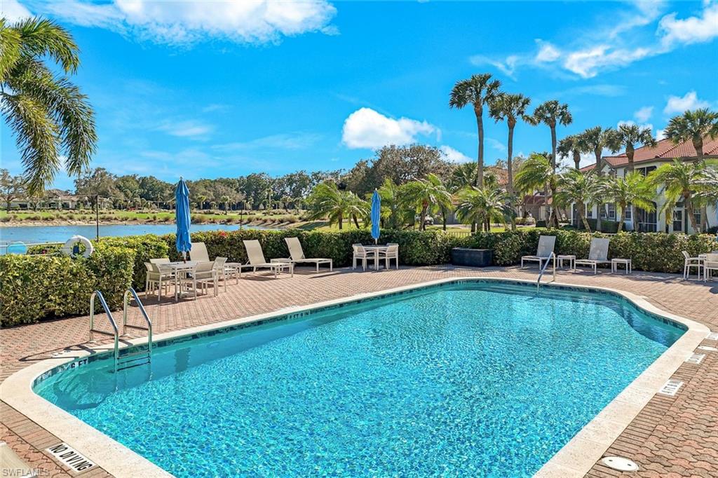 Community pool featuring a patio